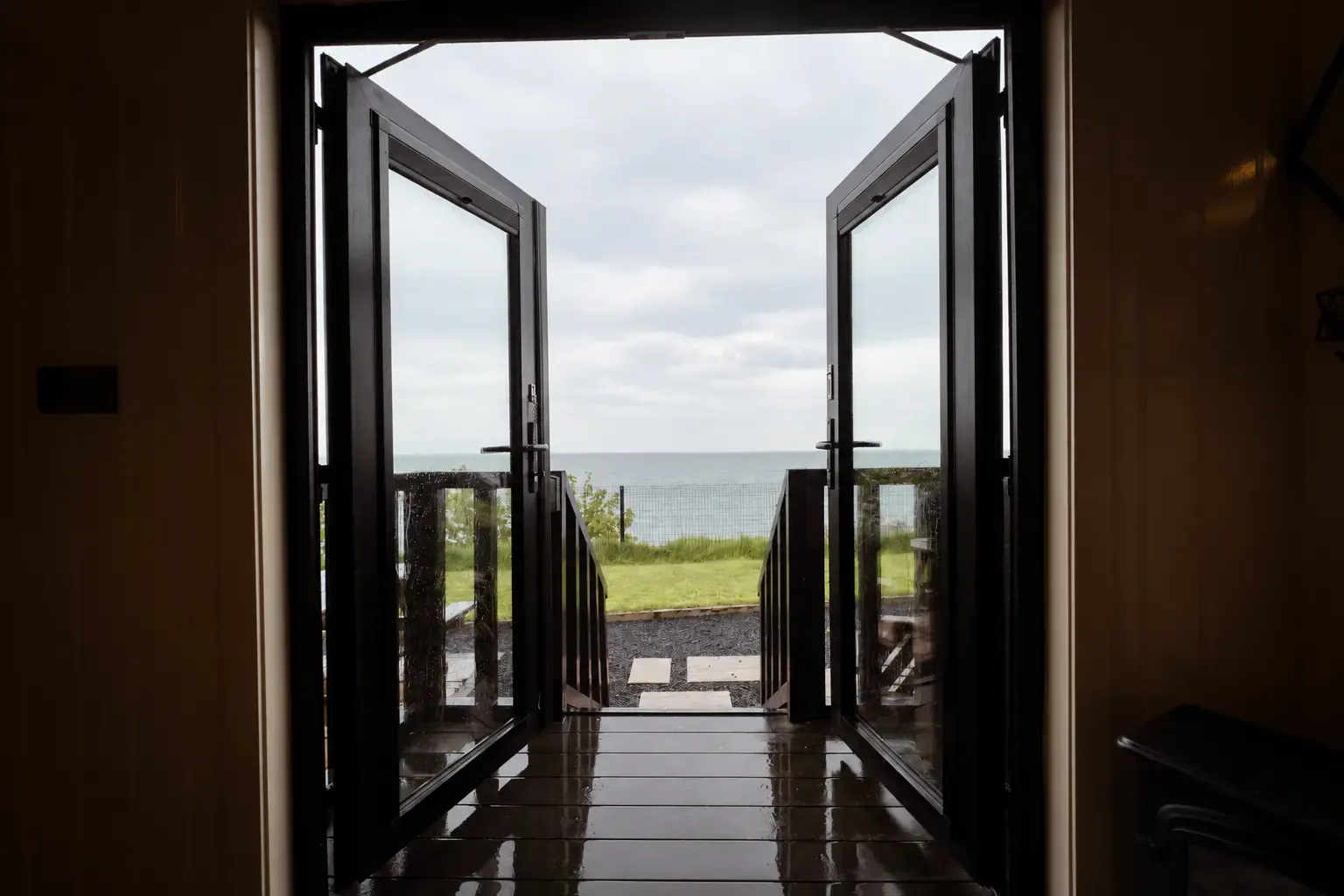 Open hut doors looking towards the Antrim coast